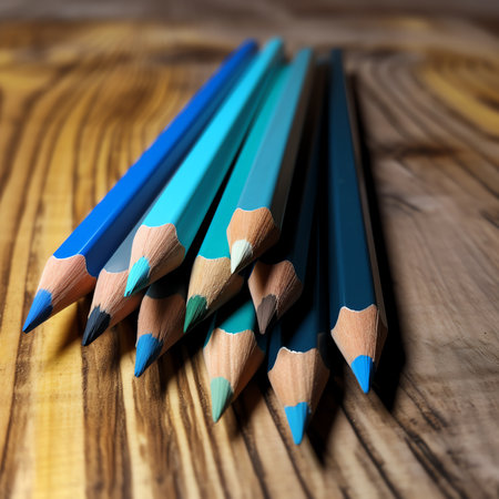 Generative AI : Colorful sharpened pencils are lined up on the tableの素材