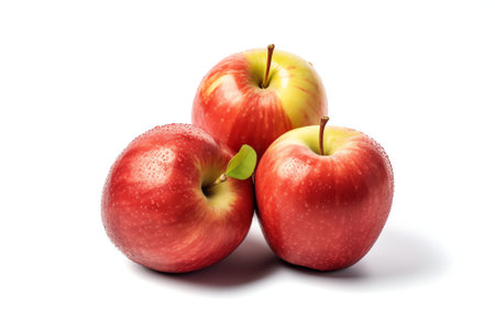 Generative AI : Three fresh red apples with drops isolated on whiteの素材