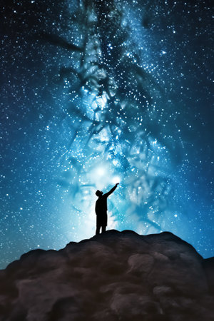 Generative AI : Starcatcher A person is standing next to the Milky Way galaxy pointing on a bright starの素材
