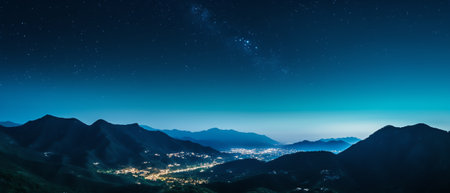 Generative AI : Starry sky over mountains panorama with city lights belowの素材