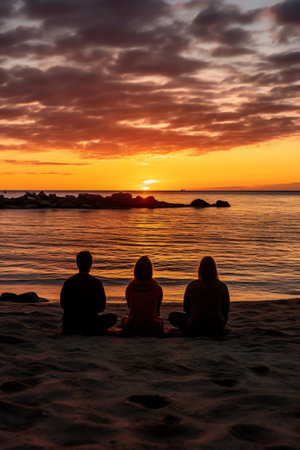 Generative AI : Silhouette of people watching the sun rising at the coastの素材