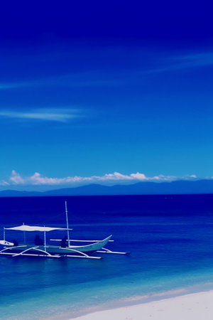 Generative AI : Boats moored on sea against clear blue skyの素材