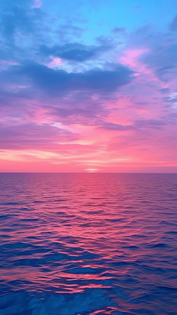 Generative AI : Beautiful colorful evening sunset sky over sea in blue and pink tonesの素材