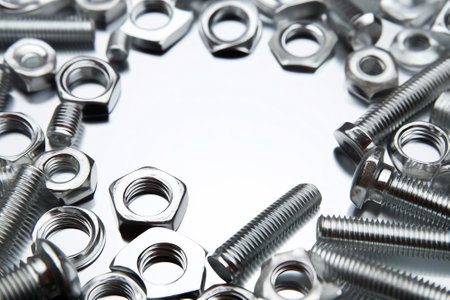 Generative AI : Beautiful art composition closeup macro chrome silver bolts and nut on a white and blue background with reflection Metal texture Concept for construction repair mecの素材