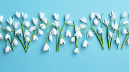 Generative AI : Delicate white spring forest flowers on a blue background Spring natural flower background Border of flowersの素材