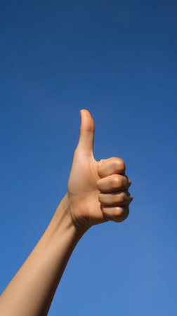Generative AI : Female hand point on blue sky backgroundの素材