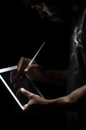Generative AI : A man playing with a tabletの素材