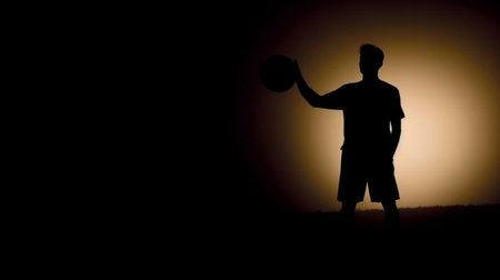 Generative AI : Silhouette of a  soccer player on a football field at sunset Sporty man is dribbling with the ball outdoorの素材