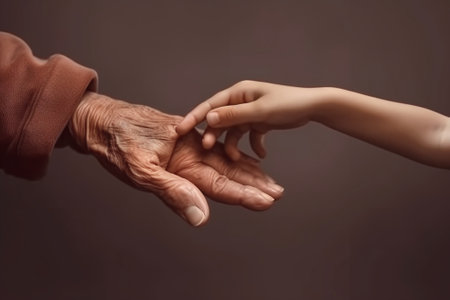 Generative AI : The concept of generations Hand of a child and an elderly personの素材