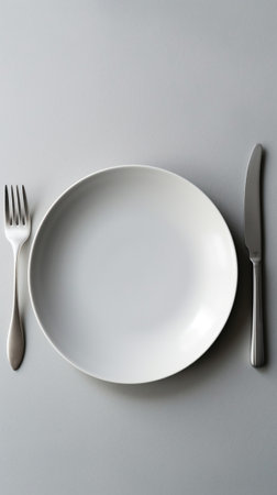 Generative AI : white cutlery set a pair of fork and spoon on white ceramic plateの素材