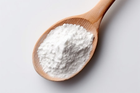 Generative AI : Broken eggs and flour in wooden spoon on white background baking backgroundの素材