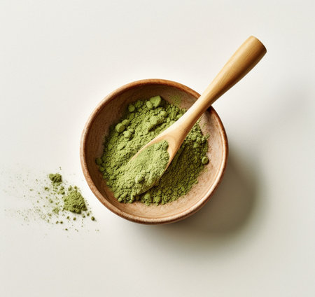 Generative AI : Matcha green tea cooking process in a bowl with bamboo whisk Black slate background Top view Copy spaceの素材