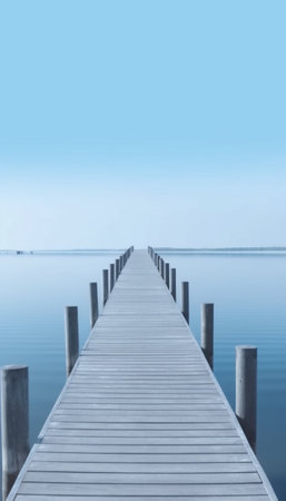 Generative AI : A wooden dock pier on a lake in summer sunny day blue sky white clouds lakeの素材