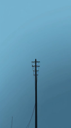 Generative AI : tall electric pylon on blue sky as backgroundの素材