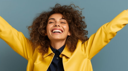 Cheerful young woman stretching out hands for hugging while standing against yellow background : Generative AIの素材