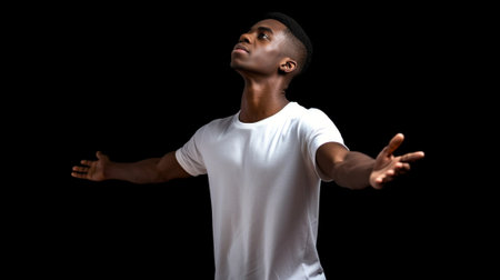 Calm and confident Portrait of young African man keeping eyes closed while standing against black background : Generative AIの素材