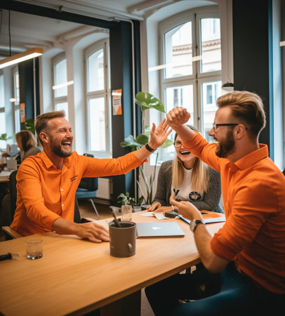 Give me highfive Two handsome man giving highfive and holding coffee cups with smile while sitting on the couch at office with their beautiful coworker : Generative AIの素材