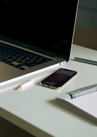 Everything you need for good work Closeup of office desk with laptop and mobile phone laying on it : Generative AIの素材