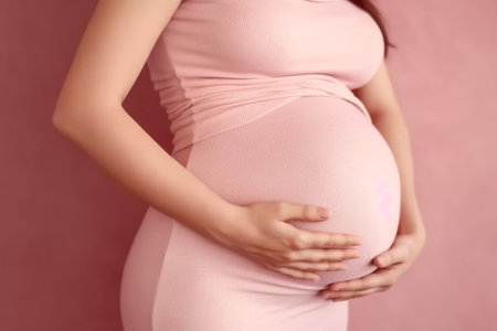 Pregnancy Side view cropped image of pregnant woman holding hands on her abdomen : Generative AIの素材