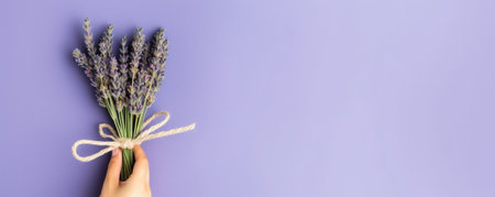 Male hand holding purple artichoke flower on gray background greeting card or concept The work of the florist at a flower shop Fresh cut flower : Generative AIの素材