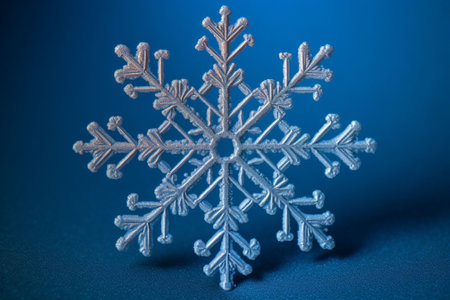 Snowflake on bright blue gradient background This is macro photo of real snow crystal medium size : Generative AIの素材