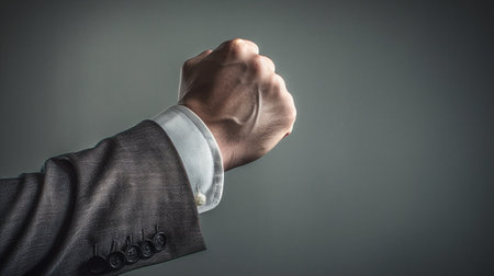 A man fists clenched focused on the fist : Generative AIの素材