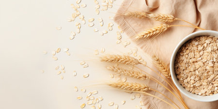 bowl of dry oatmeal with ears of wheat on light background with copy space for text. Cooking oats porridge concept. Flat lay : Generative AIの素材