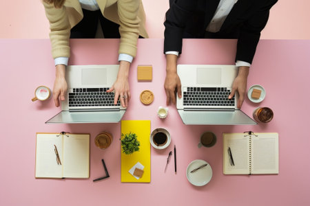 Collaborating process Two professional workers have brainstroming meeting in office pose at desktop cooperate for making common task make blueprints isolated over pink ba : Generative AIの素材