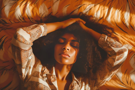 Pretty upset curly Afro American woman rubs eyes feels frustrated has sleepy face expression applies collagen patches awakes early in morning poses against blue backgroun : Generative AIの素材