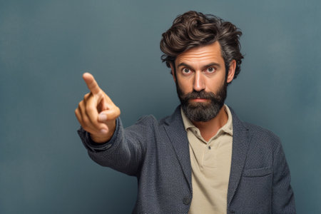 Curious scrupulous male model with trendy hairrdo and beard looks attentively at one point sees something strange or suspicious Angry man tries to overhear wifes talk loo : Generative AIの素材