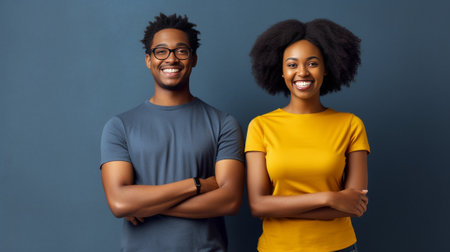 Indoor shot of two friendly woman and man with dark skin spend free time together being in good mood wear casual t shirts isolated over yellow wall Afro American girl lea : Generative AIの素材