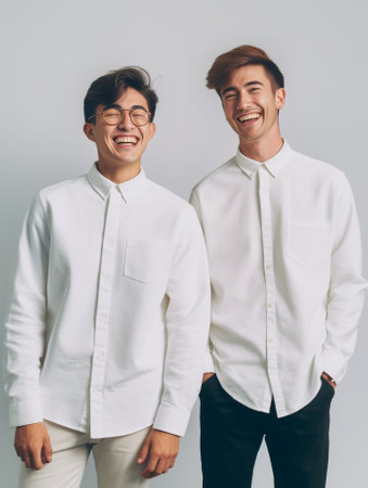 Waist up shot of two young men of different generation have uexpected gaze at camera wears round transparent glasses cant believe in shocking rumors pose together against : Generative AIの素材