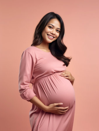 Ethnic pregnant woman holds tummy and has contractions going to give birth holds baby mobile toy and bodysuit on shoulder starts to feel pain suffers belly ache isolated  : Generative AIの素材
