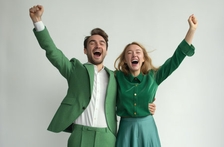 People happiness winning victory success and good luck Indoor shot of two young Caucasian people man and woman expressing their excitement and delight by shouting Yes and : Generative AIの素材