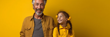 Vertical shot of self confident dad and little daughter clench fists make flying gesture hold hands being team of superheroes wears special costumes isolated on yellow ba : Generative AIの素材