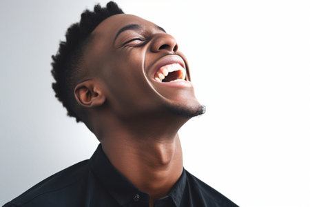 Handsome unshaven young darkskinned male laughing out loud at funny meme he found on internet smiling broadly showing his white straight teeth Positive human facial expre : Generative AIの素材