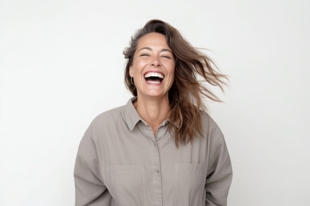 Funny woman on grey background Cheerful female model joyful Positive human emotion facial expression body language : Generative AIの素材