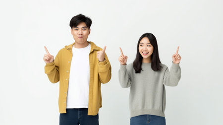 Clueless and puzzled stylish male and female standing at white wall with copy space for your text having confused looks shrugging shoulders as if saying Who cares I dont  : Generative AIの素材