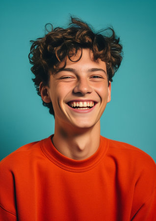 Handsome guy showing ok sign on blue background Young curly man in red sweater smiling and posing on isolated backdrop : Generative AIの素材