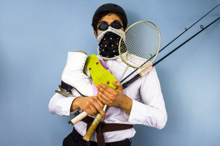 Young man with too many recreational pursuitsの写真素材