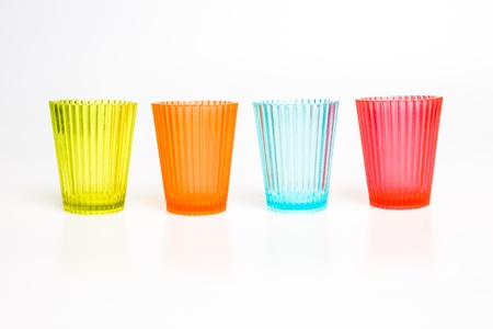 Colorful shot glasses isolated on whiteの写真素材
