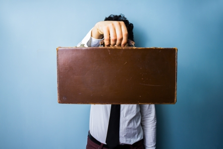 Businessman presenting a briefcase of important documentsの写真素材