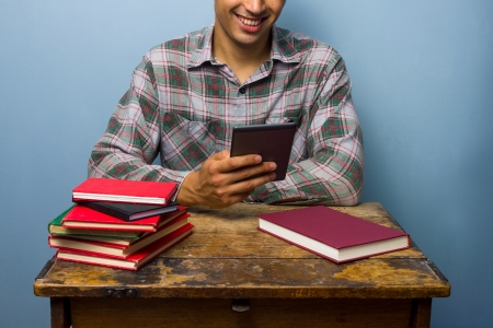 Man prefers digtal reader to booksの写真素材