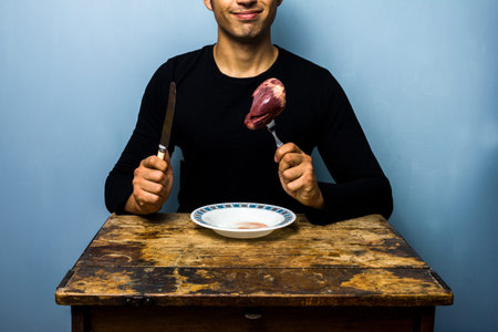 Brave young man is about to eat a raw heart