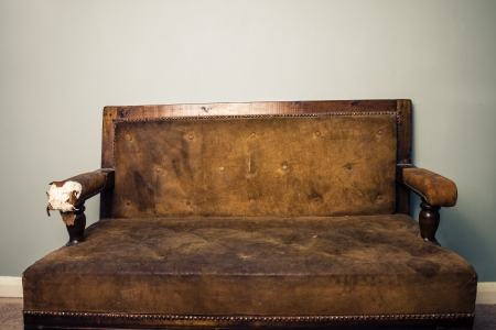 Old worn out vintage sofa の写真素材