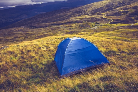 Tent pitched on mountainsideの写真素材