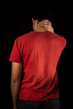 Young man with neck painの写真素材