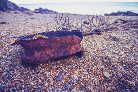 Rusted old wheel on the coastの写真素材