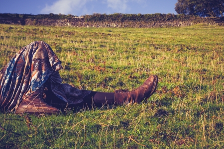 Close up on a young woman s legs as she is relaxing in countrysideの写真素材