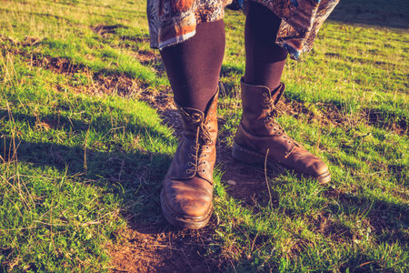 Close up on a young woman s legs as she is hiking in countrysideの写真素材